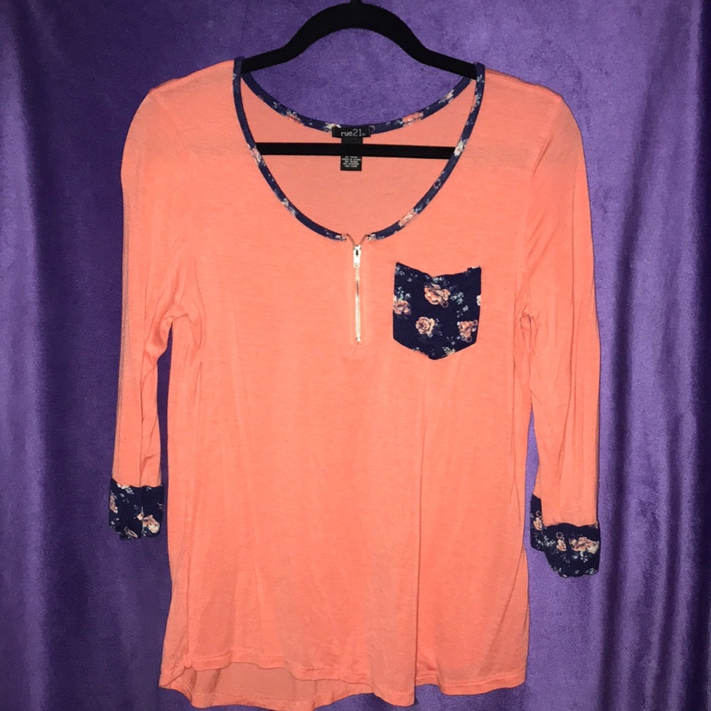 Coral shirt with a floral accent and zipper